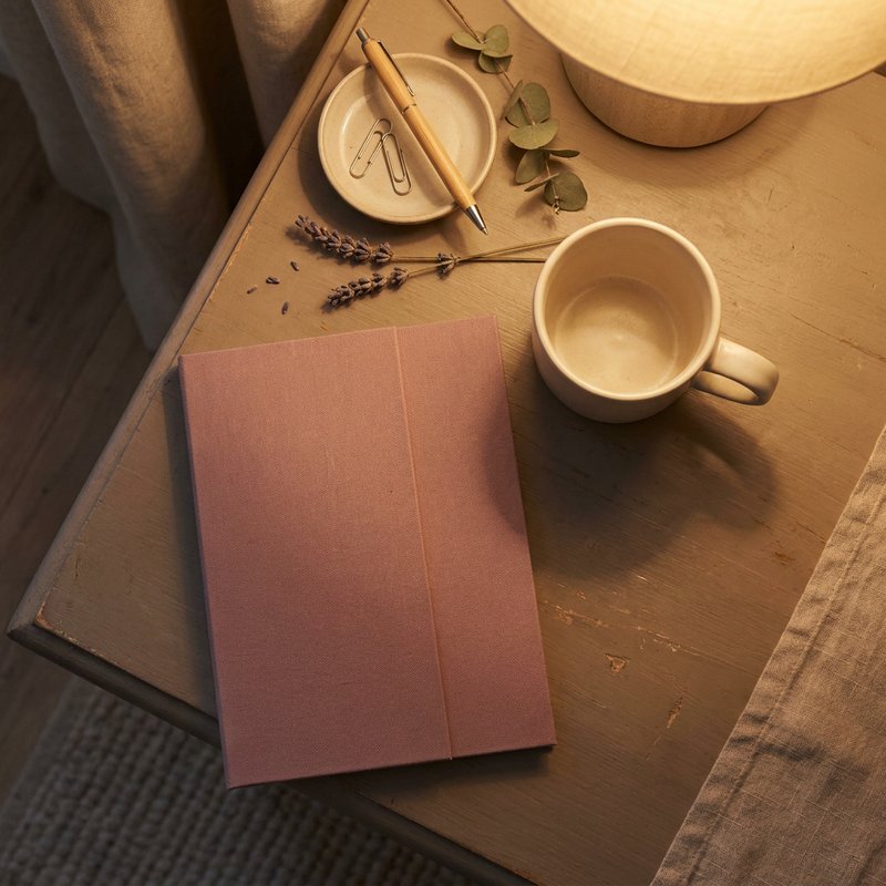 adhd task management — a tidy desk corner at the end of the day with a closed folder and a mug, lacedopamine.com