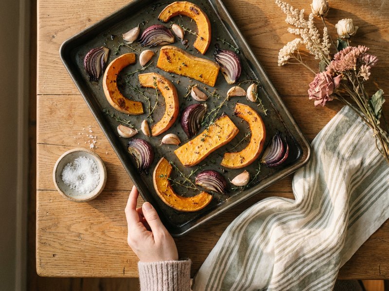 sheet pan autumn vegetables for fall dinner ideas ADHD, roasted squash and onion on a warm tray, lacedopamine.com