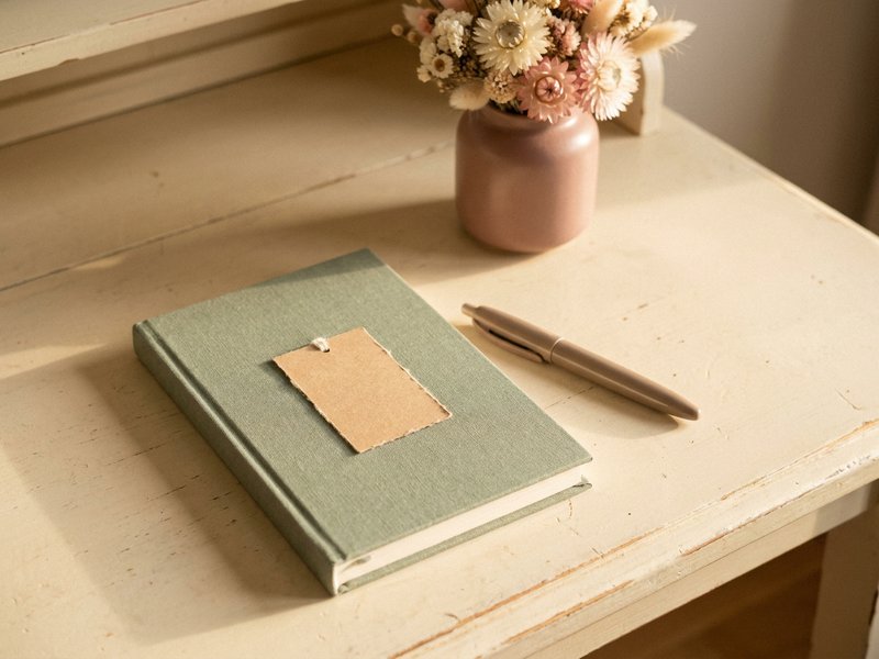 notebook with an unfinished sentence marking a pomodoro return cue for ADHD