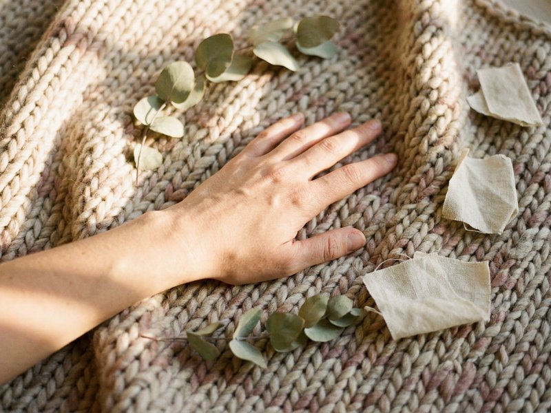 what is RSD — a hand resting over the heart on a soft knitted blanket, lacedopamine.com