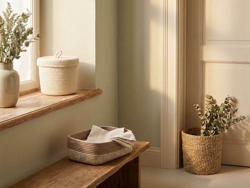 ADHD organization mistakes — several small catch bins placed around a room, lacedopamine.com