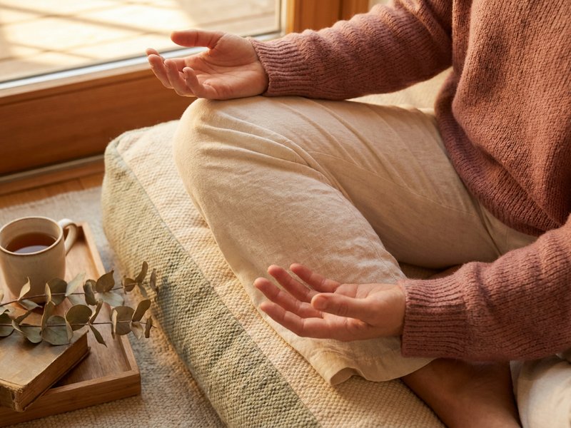 mindfulness practice ADHD — hands resting on the knees during a quiet moment, lacedopamine.com