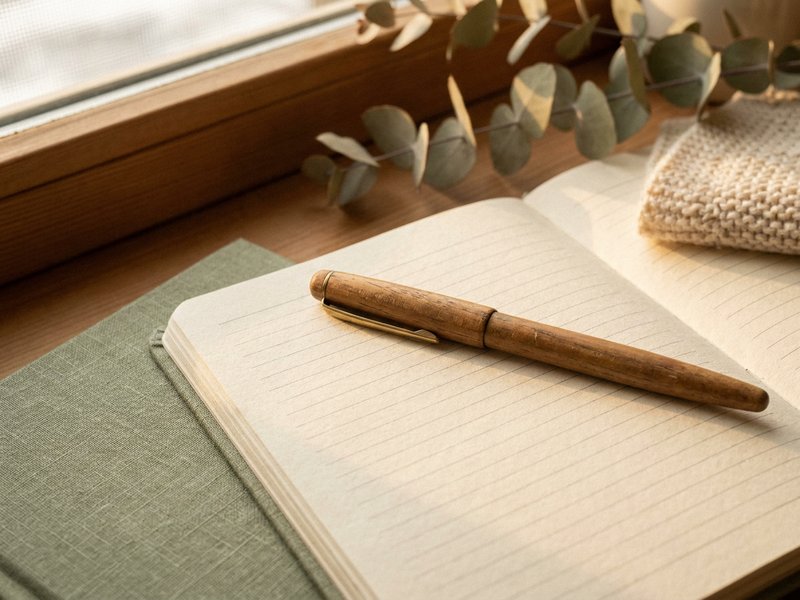 new year journal prompts ADHD — a pen resting on an open page, lacedopamine.com
