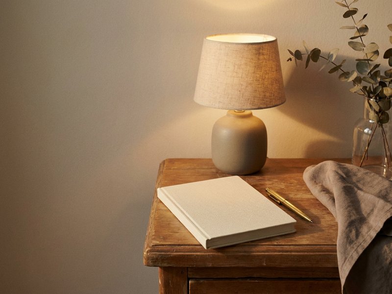 how to sleep with racing thoughts ADHD — a notebook and pen used to empty racing thoughts before bed, lacedopamine.com