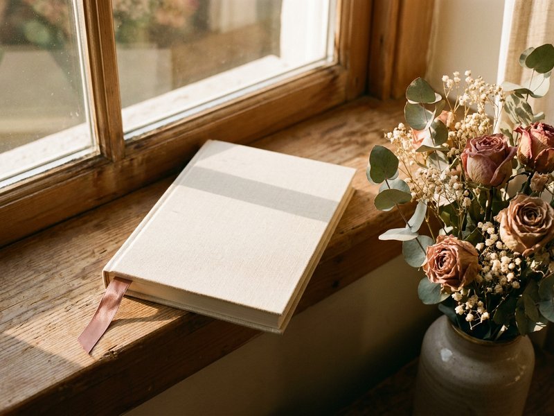 soft journaling 2026 — a closed notebook resting on a sunlit windowsill, lacedopamine.com