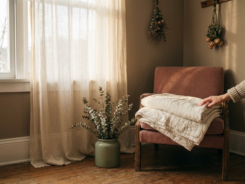 how to start yoga ADHD — a small calm corner with a folded blanket and a plant, lacedopamine.com