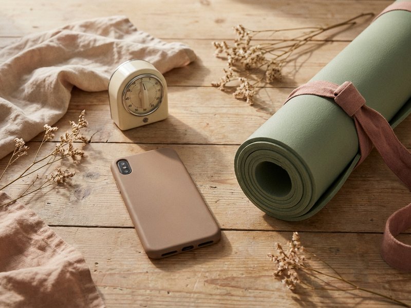 how to start yoga ADHD — a phone timer set beside a rolled mat, lacedopamine.com