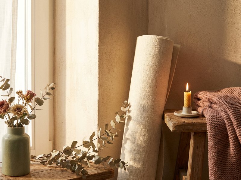 yoga vs pilates ADHD — a single yoga mat set up for a calming home practice, lacedopamine.com
